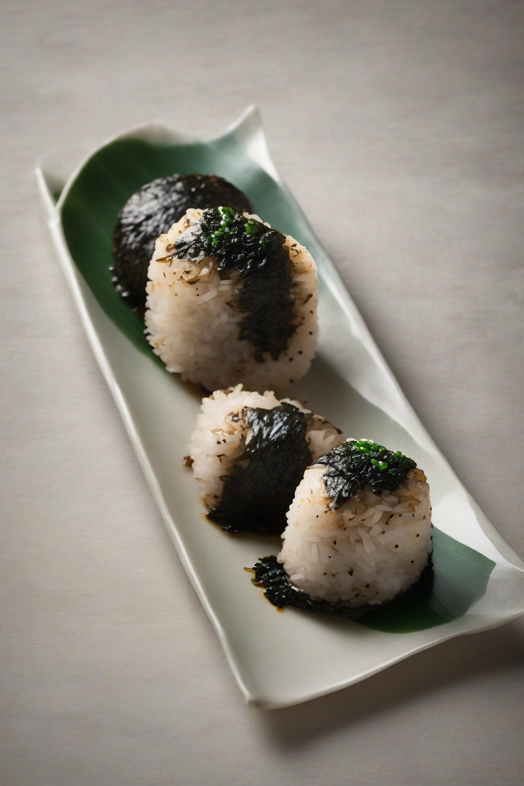 A high-resolution photo of steamed shiitake onigiri with dark mushroom flecks, wrapped in nori, under soft lighting.